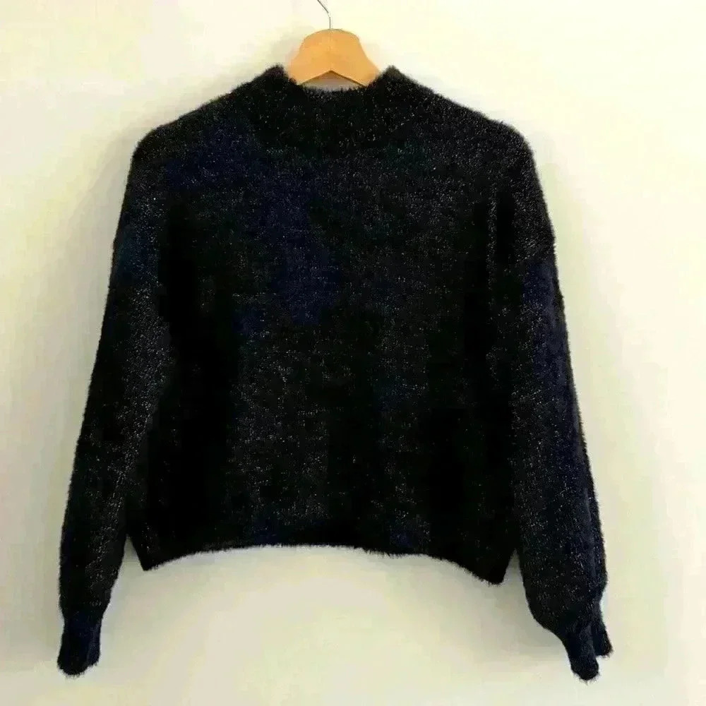 Women’s crop sweater. Black with silver threading, giving holiday feels.